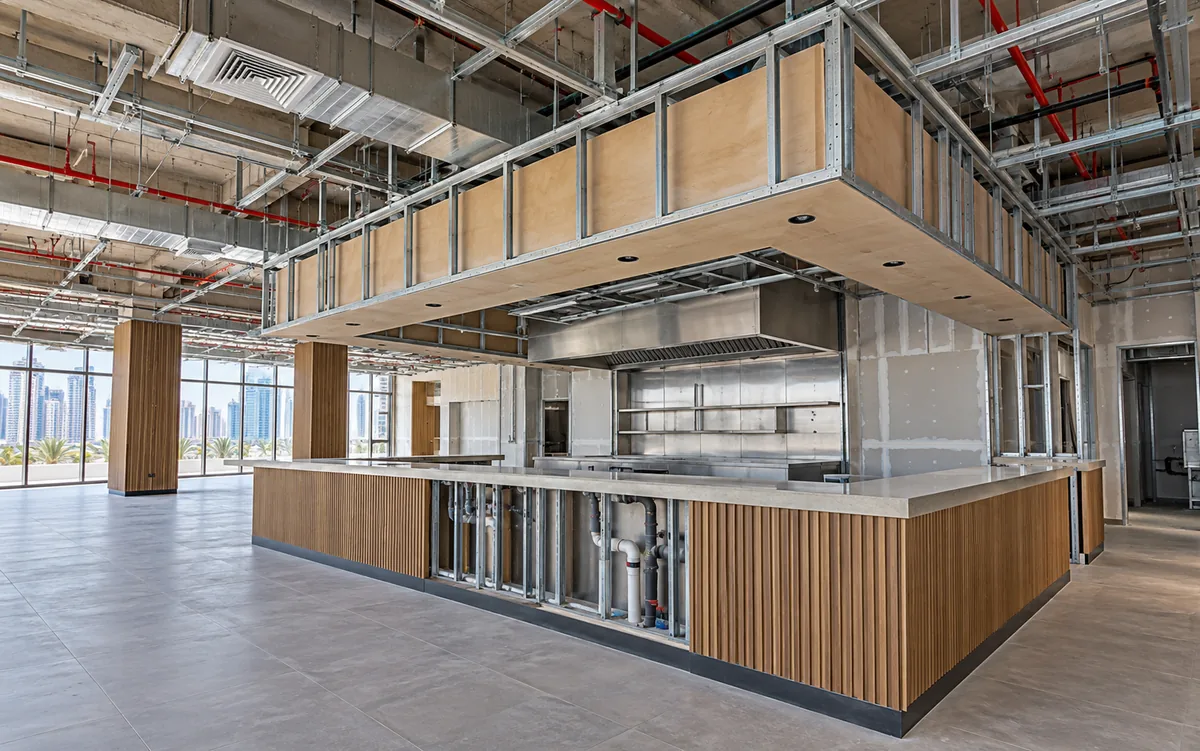 Restaurant fit-out with coordinated ventilation, electrical and plumbing routes